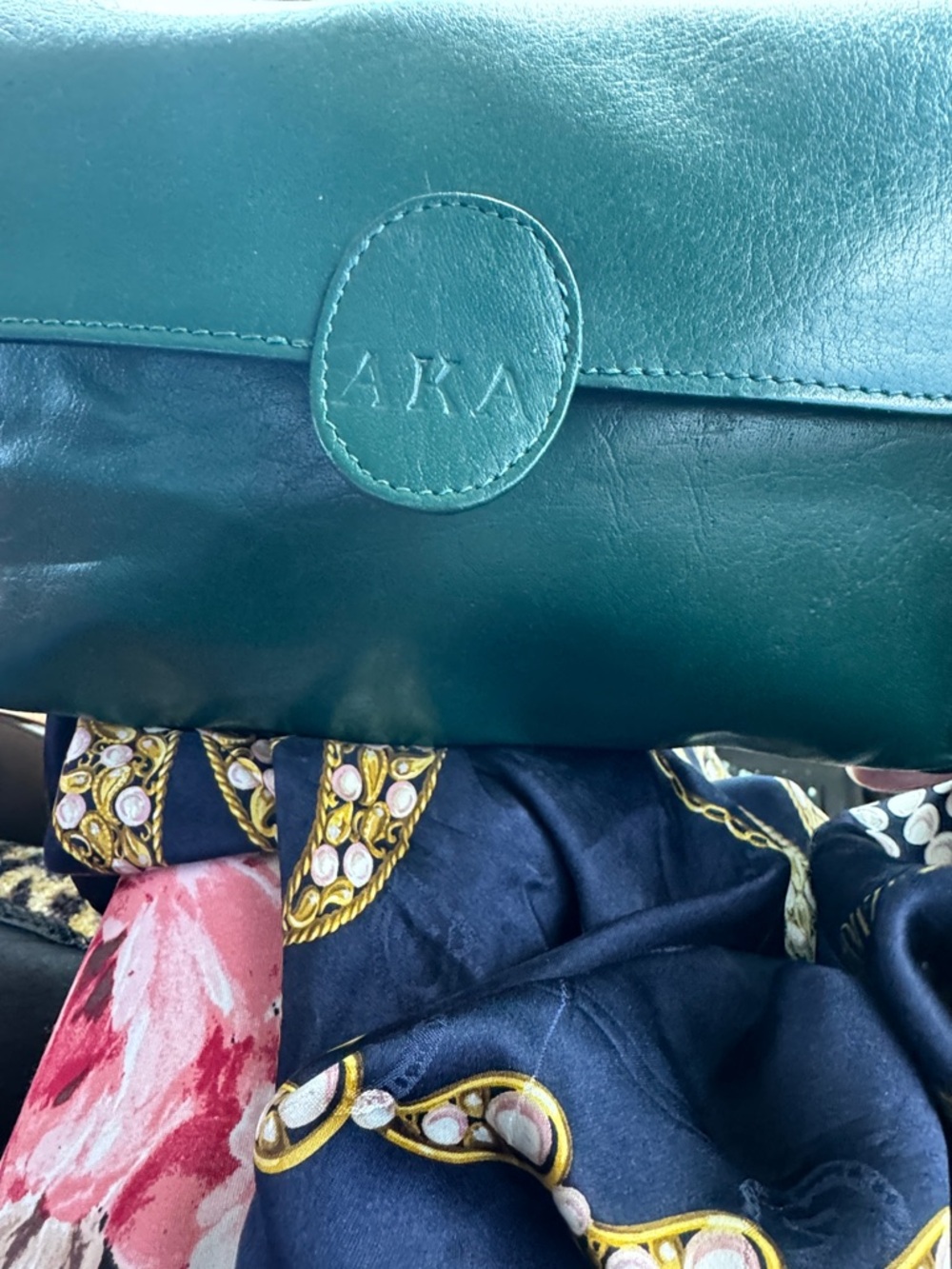AKA Teal Leather Clutch Bag. You could add a chain turn into crossbody easily.